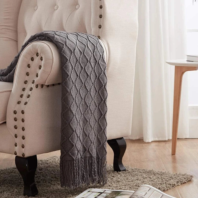 Plaid tricoté oversized à pompons — Chaleur boho & cocooning visuel